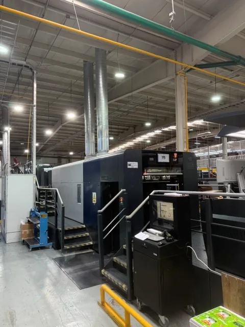 A modern sheetfed offset press producing federal-spec packaging at GMS Industries
