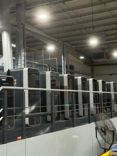 A modern multi-colour sheetfed press line running a custom packaging job at a GMS Industries plant